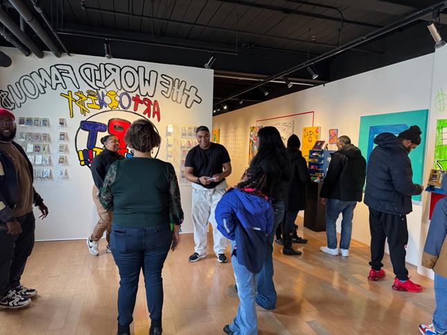 people interacting with the exhibition at the reception